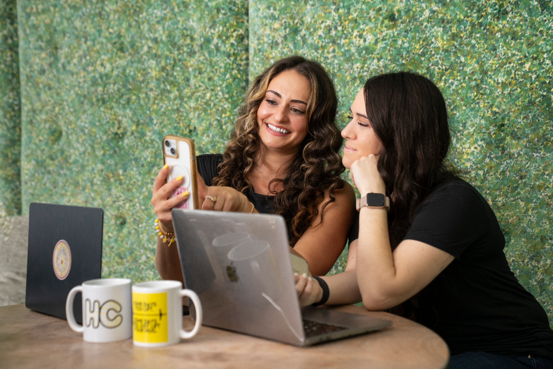 Taylor and a client reviewing the HC app together